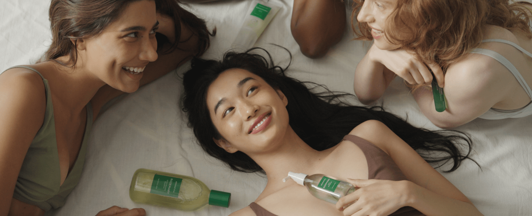 Aromatica brand campaign featuring women with natural skincare products in a relaxed setting