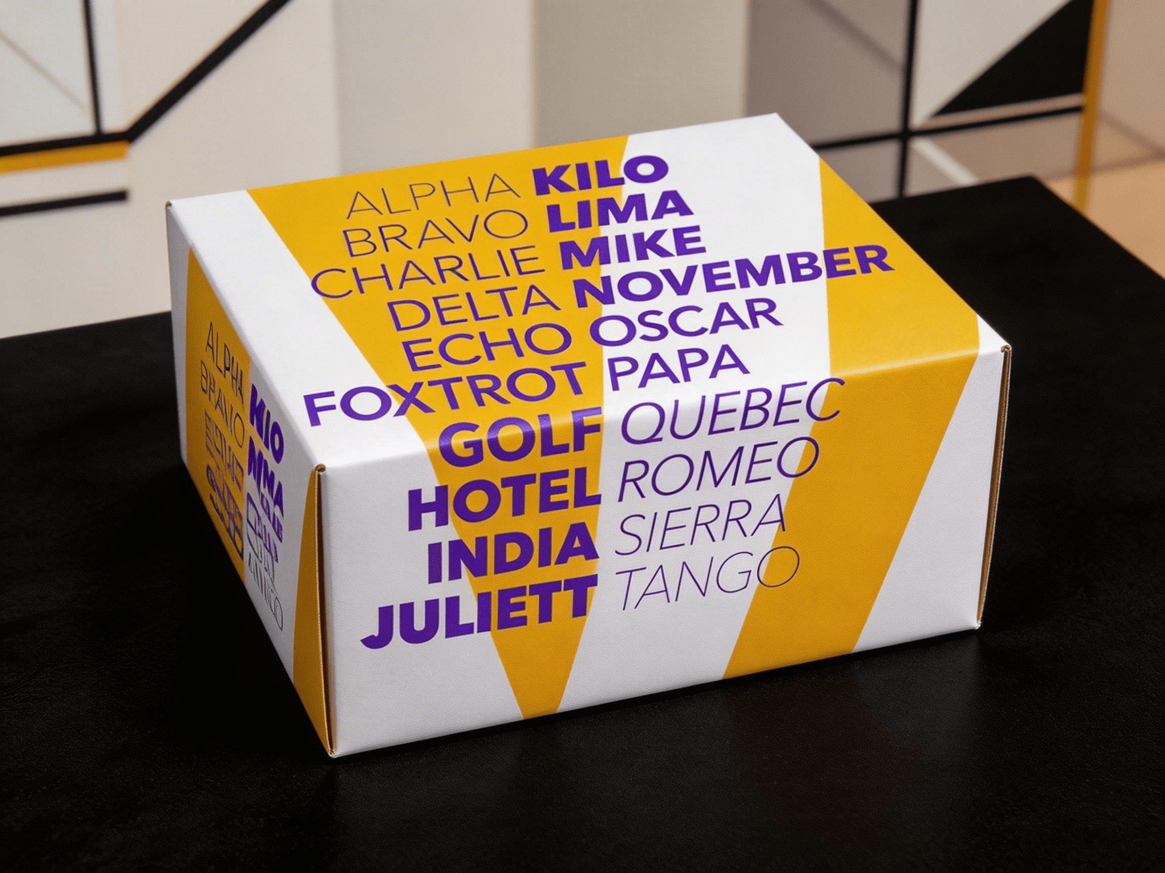 Avenir 서체로 알파벳이 인쇄된 노란색 제품 박스